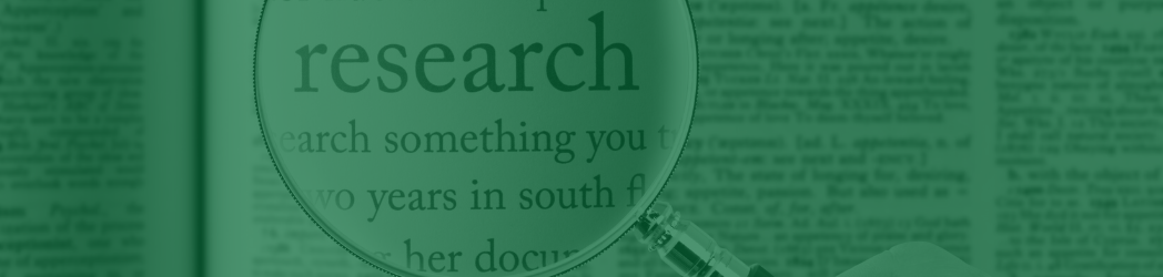 Magnifying glass with the word "research" enlarged