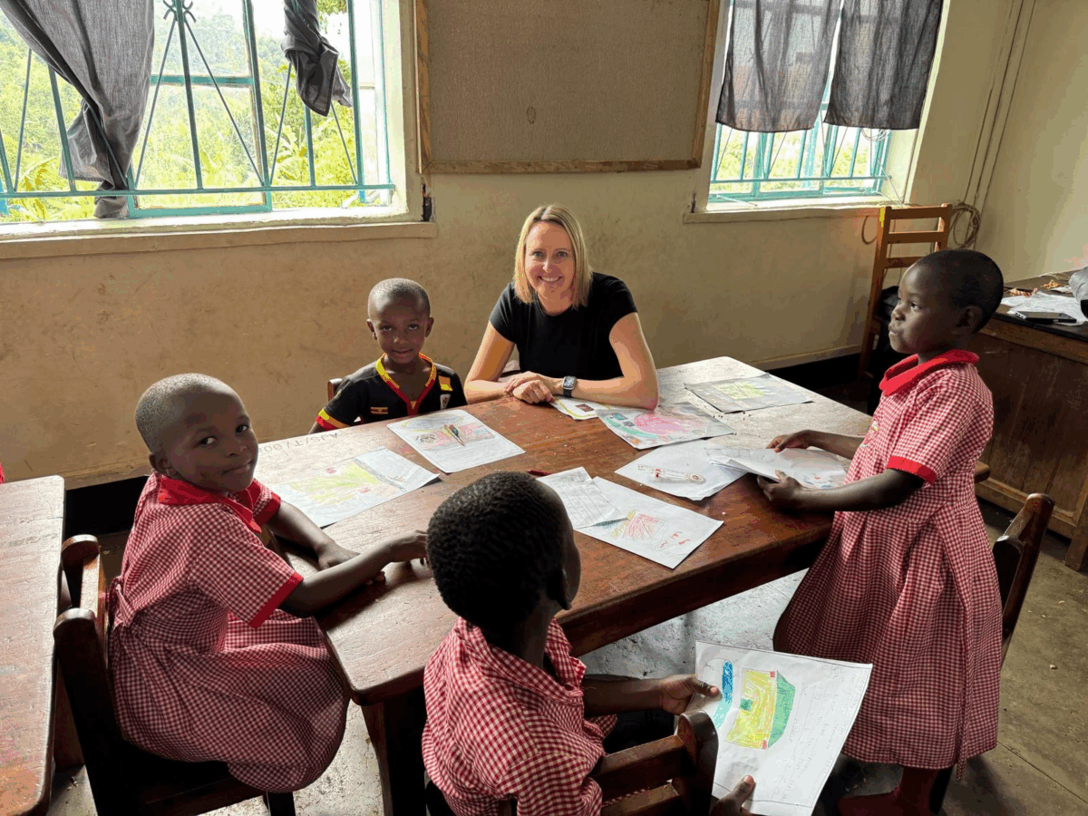 Erin Kowalevicz working directly with elementary school students in Uganda