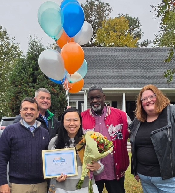 Claire Hsieh celebrating her Teacher of the Year award with colleagues