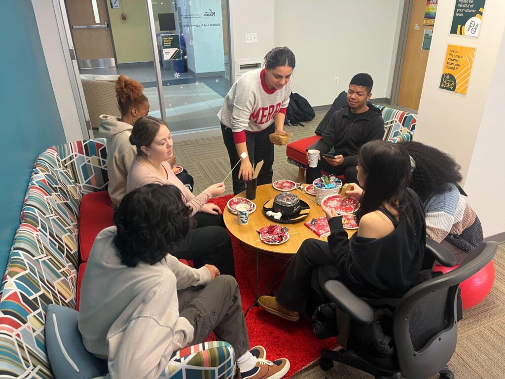 Students making s'mores at the CEHD De-Stress event in December 2025.